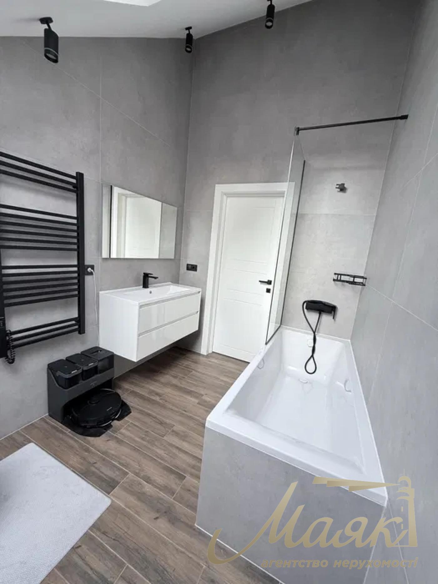 A stylish two-story house is for sale in a cozy wooded area in the village of Khodosivka—the perfect place for those who appreciate peace and quiet, nature, and the comforts of modern life.