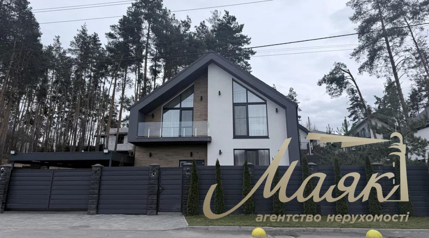 A stylish two-story house is for sale in a cozy wooded area in the village of Khodosivka—the perfect place for those who appreciate peace and quiet, nature, and the comforts of modern life.