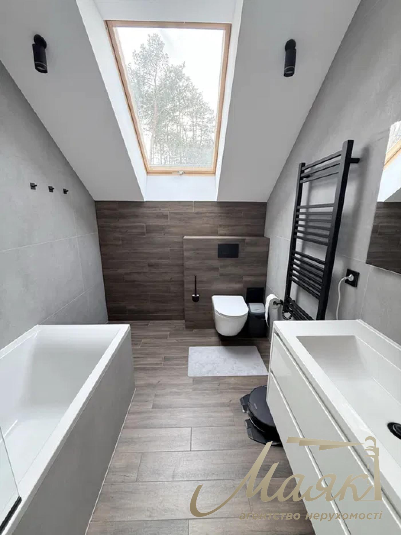 A stylish two-story house is for sale in a cozy wooded area in the village of Khodosivka—the perfect place for those who appreciate peace and quiet, nature, and the comforts of modern life.