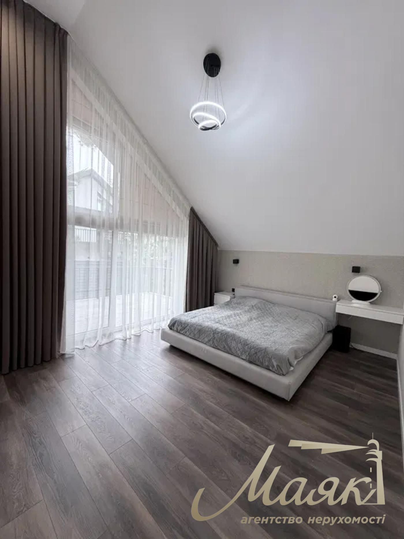 A stylish two-story house is for sale in a cozy wooded area in the village of Khodosivka—the perfect place for those who appreciate peace and quiet, nature, and the comforts of modern life.