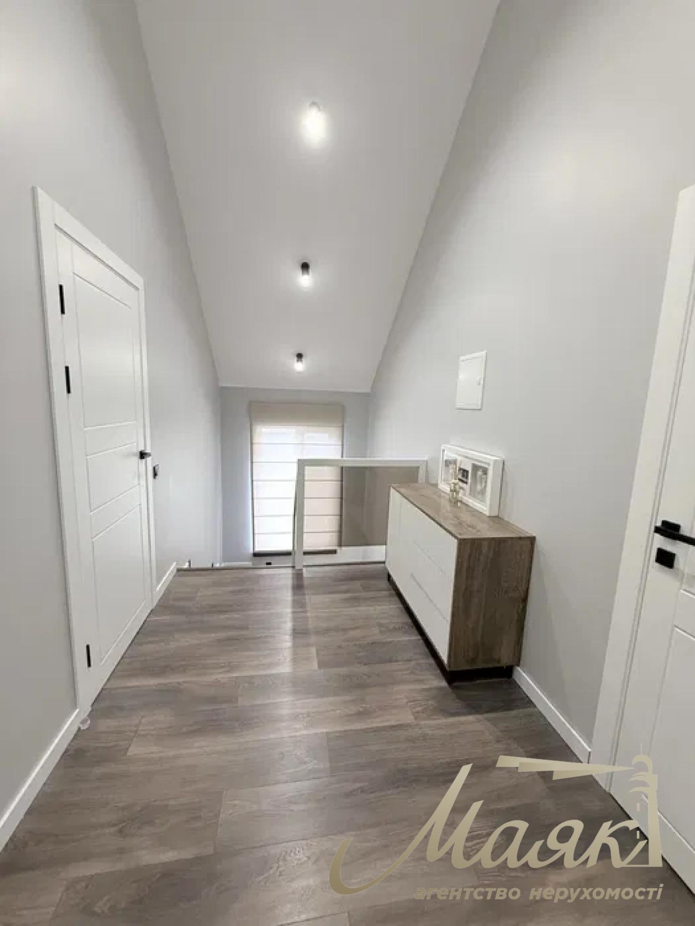 A stylish two-story house is for sale in a cozy wooded area in the village of Khodosivka—the perfect place for those who appreciate peace and quiet, nature, and the comforts of modern life.